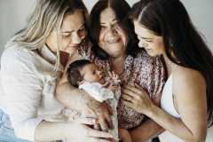 Newborn sessions at home are a beautiful way to capture extended family. 