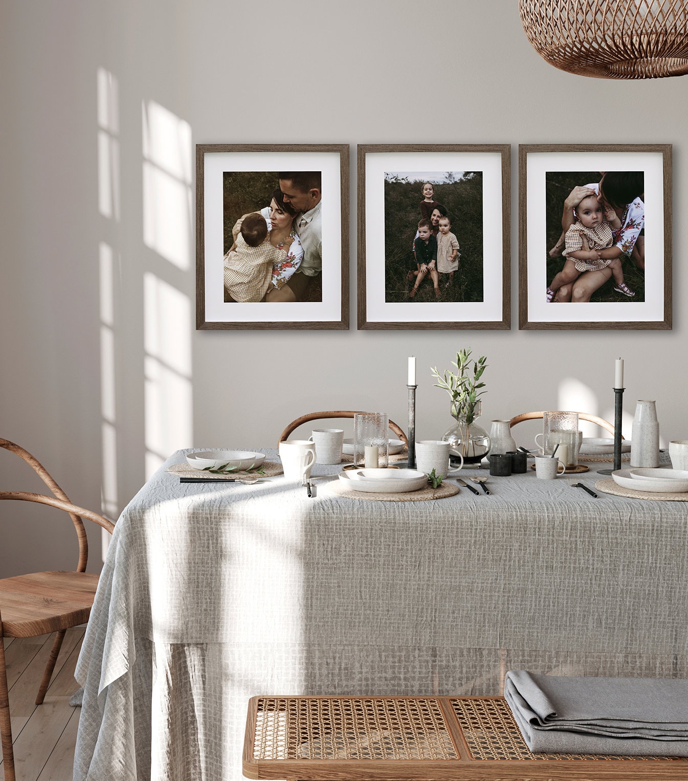 A collection of frames hangs above a bed