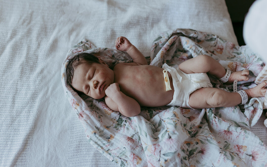 When should I book newborn photos?